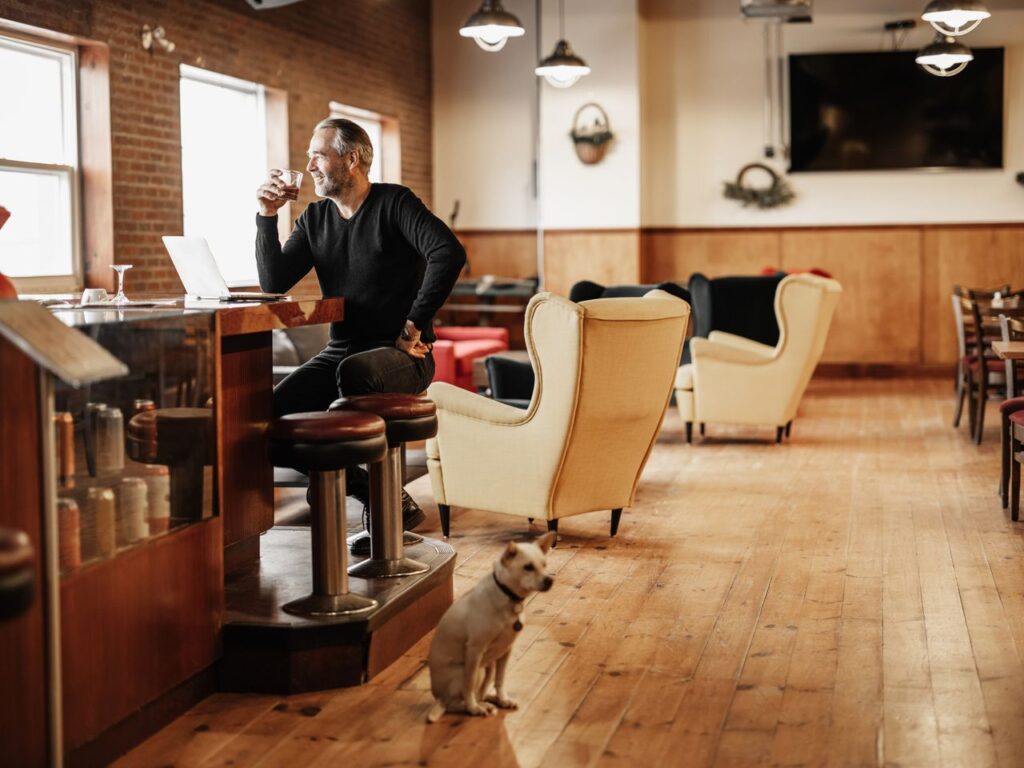 Owner of small business working at the bar