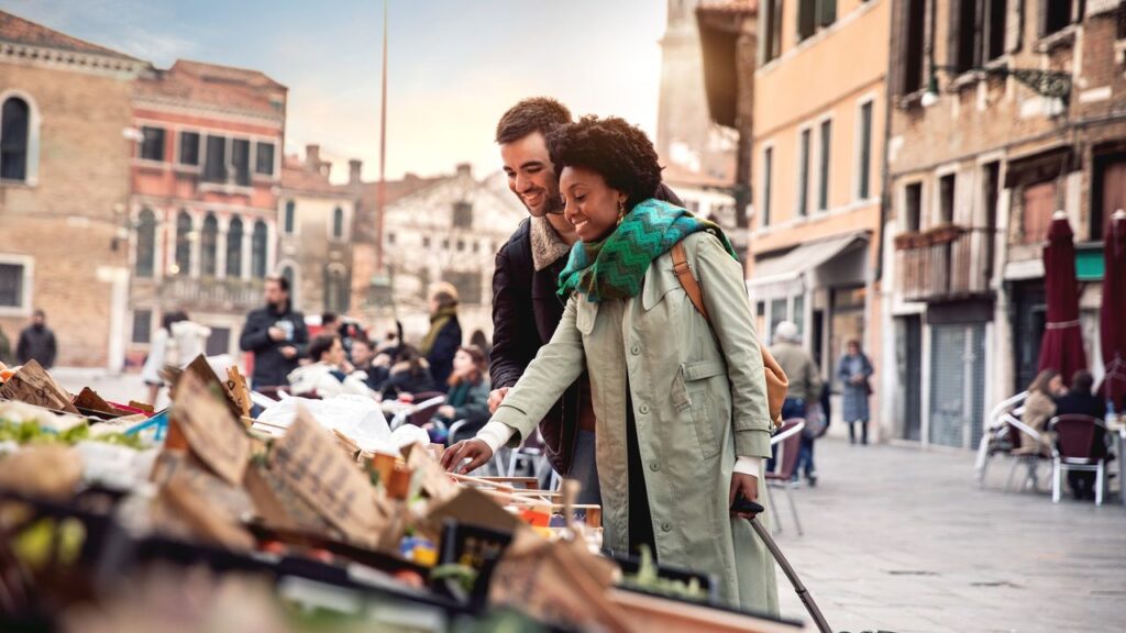 Hispanic brazilian couple enjoying an holiday vacation in Venice - Italy