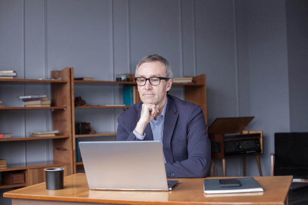 man-older-laptop-gettyimages-1457324752