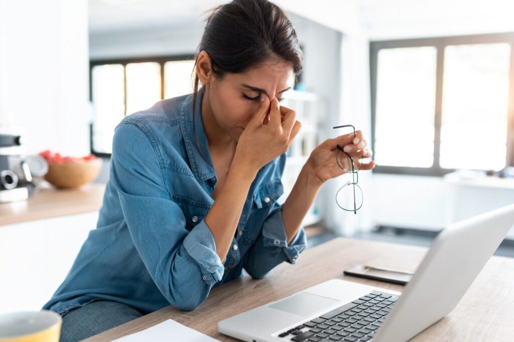2147005-stressed-woman-sitting-front-computer