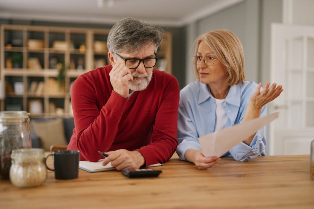 Senior couple stressing over household budget planning