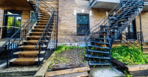 two-exterior-iron-staircases-in-front-of-homes-on-a-typical-montreal-street